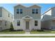 Two-story house with gray siding, and a manicured lawn at 434 Belmond Dr, Debary, FL 32713