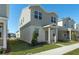 Two-story house with gray siding, a red door and a manicured lawn at 434 Belmond Dr, Debary, FL 32713