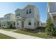 Two-story house with gray siding, a red door and a manicured lawn at 434 Belmond Dr, Debary, FL 32713