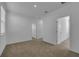 Bright hallway with doors to bedrooms and carpeting at 434 Belmond Dr, Debary, FL 32713