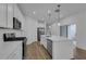 Stylish kitchen with an island, stainless steel appliances and white cabinets at 434 Belmond Dr, Debary, FL 32713
