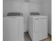Bright laundry room with side-by-side washer and dryer at 434 Belmond Dr, Debary, FL 32713