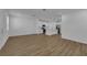 Open living room with kitchen, hardwood floors, and island at 434 Belmond Dr, Debary, FL 32713