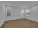 Spacious living area featuring hardwood floors and large windows at 434 Belmond Dr, Debary, FL 32713