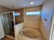 Bathroom with shower and tub combination at 10065 Lake District Ln, Orlando, FL 32832