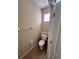 Small bathroom with toilet and single sink at 10065 Lake District Ln, Orlando, FL 32832