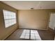 Simple bedroom with carpet and large window at 10065 Lake District Ln, Orlando, FL 32832