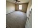 Large bedroom with ceiling fan and window at 10065 Lake District Ln, Orlando, FL 32832