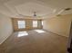 Bright bedroom featuring a ceiling fan and ample natural light at 10065 Lake District Ln, Orlando, FL 32832