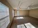 Spacious bedroom with ceiling fan and large window at 10065 Lake District Ln, Orlando, FL 32832