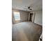 Bedroom with ceiling fan and window at 10065 Lake District Ln, Orlando, FL 32832
