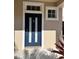 Inviting front door with sidelights and transom window at 10065 Lake District Ln, Orlando, FL 32832