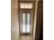 Interior view of front door with blinds at 10065 Lake District Ln, Orlando, FL 32832