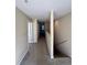 Upper level hallway with carpet and doors to bedrooms at 10065 Lake District Ln, Orlando, FL 32832