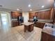 Modern kitchen with island and stainless steel appliances at 10065 Lake District Ln, Orlando, FL 32832