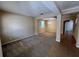 Open concept living room with tile floors and view to kitchen at 10065 Lake District Ln, Orlando, FL 32832
