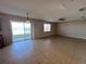 Living room with access to patio and lake view at 10065 Lake District Ln, Orlando, FL 32832