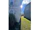 Side yard of the house with green grass at 10065 Lake District Ln, Orlando, FL 32832