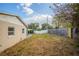 Backyard view showing a large grassy area and wooden fence at 4533 San Sebastian Cir, Orlando, FL 32808