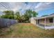 Large backyard with a wooden fence at 4533 San Sebastian Cir, Orlando, FL 32808