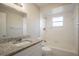 Updated bathroom with granite countertop and white cabinetry at 4533 San Sebastian Cir, Orlando, FL 32808
