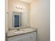 Bathroom with granite countertop and white vanity at 4533 San Sebastian Cir, Orlando, FL 32808