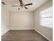 Bright bedroom featuring wood-look flooring and ceiling fan at 4533 San Sebastian Cir, Orlando, FL 32808