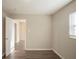 Simple bedroom with wood-look floors and an open door at 4533 San Sebastian Cir, Orlando, FL 32808