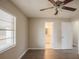 Spacious bedroom with en-suite bathroom and wood-look floors at 4533 San Sebastian Cir, Orlando, FL 32808