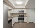 Modern kitchen with stainless steel appliances and granite countertops at 4533 San Sebastian Cir, Orlando, FL 32808