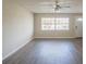 Bright living room featuring vinyl flooring and a ceiling fan at 4533 San Sebastian Cir, Orlando, FL 32808