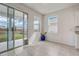 Bright breakfast nook with sliding glass door to the backyard and natural light at 7889 Penrose Pl, Wildwood, FL 34785