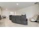 Open living room featuring tile floors, modern furniture, and plenty of natural light at 7889 Penrose Pl, Wildwood, FL 34785
