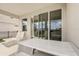 Covered patio with white table and chairs, overlooking fenced yard at 7889 Penrose Pl, Wildwood, FL 34785