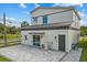 Exterior view of the home featuring a concrete tile patio, and lush landscaping at 801 W Anderson St, Orlando, FL 32805