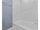 Clean bathroom with modern bathtub and marble tiled walls at 801 W Anderson St, Orlando, FL 32805