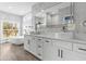Bathroom features double vanity sinks, modern soaking tub, and large vanity mirror at 801 W Anderson St, Orlando, FL 32805