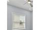 Bright bedroom with a ceiling fan, neutral walls, and a window with blinds at 801 W Anderson St, Orlando, FL 32805