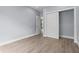 Bedroom with light wood floors, neutral walls, and closet at 801 W Anderson St, Orlando, FL 32805