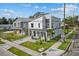 Aerial view of contemporary houses showcasing modern designs, clean landscaping, and paved driveways at 801 W Anderson St, Orlando, FL 32805