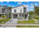 Modern two-story home with grey accents, well-manicured lawn, and paved driveway at 801 W Anderson St, Orlando, FL 32805