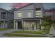 Beautifully designed two-story home with modern architectural details and landscaped front yard at dusk at 801 W Anderson St, Orlando, FL 32805
