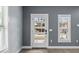 Stylish front door with multiple windows and modern hardware, allowing for plenty of natural light at 801 W Anderson St, Orlando, FL 32805