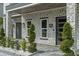 Stylish front porch with stone accents, modern lighting, and meticulously manicured landscaping at 801 W Anderson St, Orlando, FL 32805