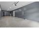 Spacious garage featuring an epoxy floor, white door, and overhead lighting at 801 W Anderson St, Orlando, FL 32805