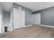 Open hallway with closet and view of downstairs, featuring grey walls and light wood floor at 801 W Anderson St, Orlando, FL 32805