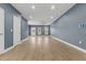 Large living room area featuring hardwood flooring, white trim, and recessed lighting at 801 W Anderson St, Orlando, FL 32805