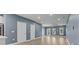 Open living room with hardwood flooring, light blue walls, and an open layout at 801 W Anderson St, Orlando, FL 32805