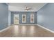 Unfurnished living room with plank floors, a ceiling fan, and ample natural light at 801 W Anderson St, Orlando, FL 32805