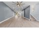 Open concept living room with hardwood floors, white trim, and a view to the kitchen at 801 W Anderson St, Orlando, FL 32805